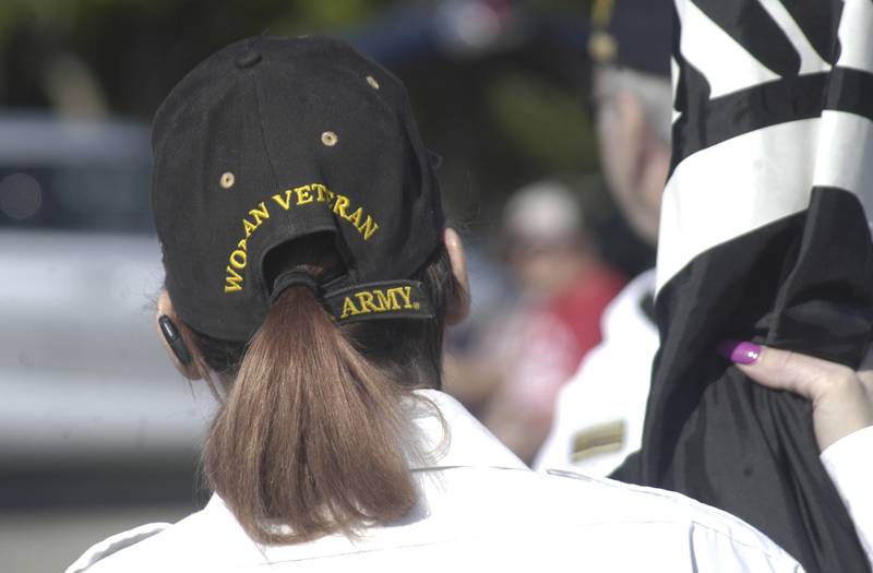 Kelly Jo Urrutia holds a flag during a Memorial Day ceremony in Rock Falls on Monday, May 25, 2026.
