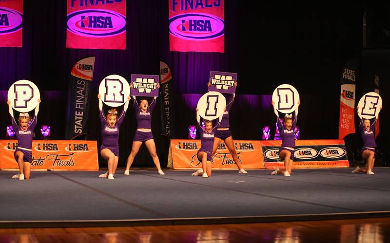 Members of the Wilmington cheer team perform during the IHSA Cheer State Finals in Grossinger Motors Arena on Saturday, Feb. 4, 2023 in Bloomington.