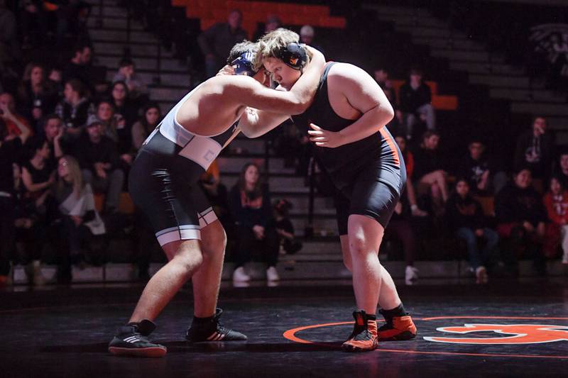 Marian Central's George Kordopitoulas and St. Charles East's Matthew Medina wrestle at 285 pounds during a match in St. Charles on Wednesday, December 20, 2023.