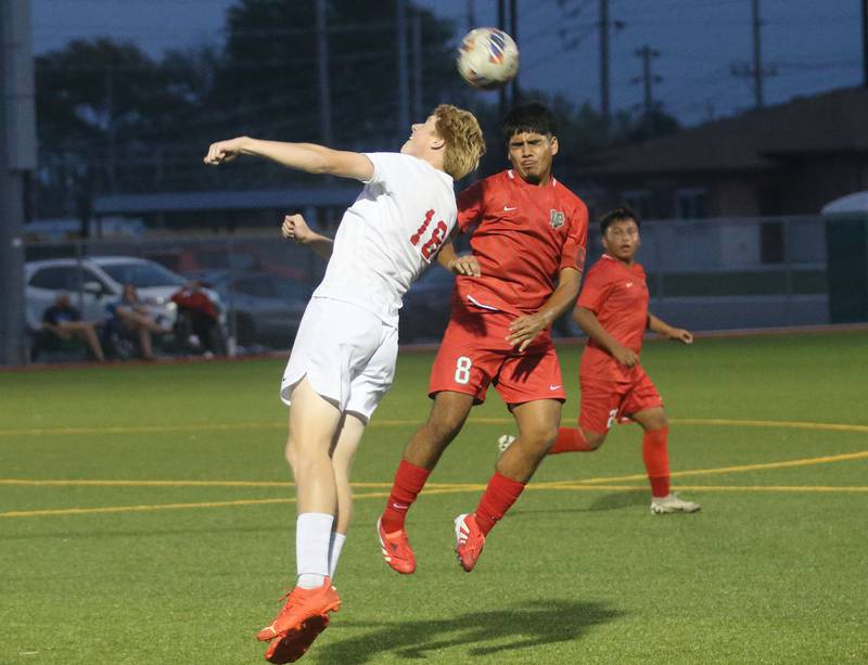 Ottawa's Robert Polier puts a header on the ball as L-P's Alex Rax watches on Monday, Oct. 6, 2025 at the L-P Athletic Complex in La Salle.