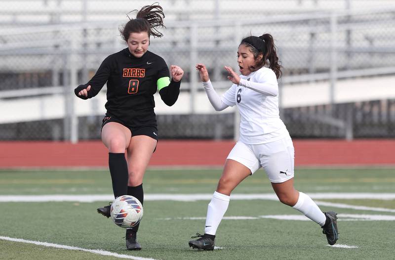DeKalb’s Claire Bettner plays the ball away from Belvidere North’s Keyla Suarez during their game Wednesday, March 15, 2023, at DeKalb High School.