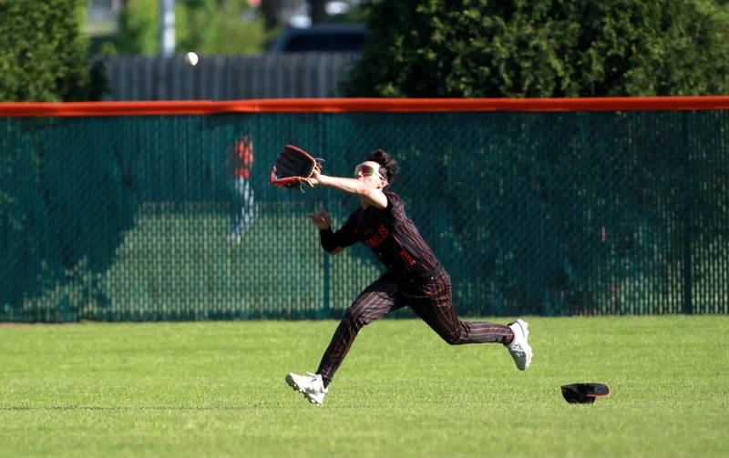 St. Charles East's Chris Dazzo makes a catch in center field during a game against Geneva on Tuesday, May 13, 2024 in St. Charles.