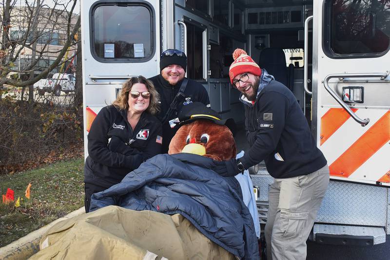 Cold and windy winter weather didn't stop runners from taking part in Morrison's Turkey trot on Saturday, Nov. 30, 2024. But one fine-feathered friend needed a helping hand and Morrison EMS was there to help the big bird thaw out and get back in action.