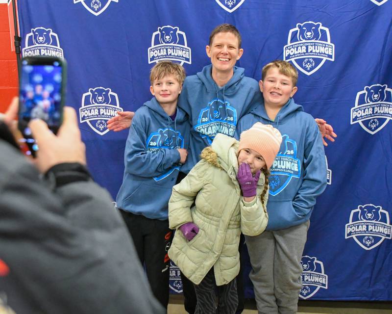 Jess Johnson of Sycamore poses for a photo with her kids Archer Tadie, 11, Weston Johnson, 11, and Rose Johnson, 8, after participating in the Polar Plunge on Saturday Feb. 21, 2026, held at Huskie Stadium in DeKalb.