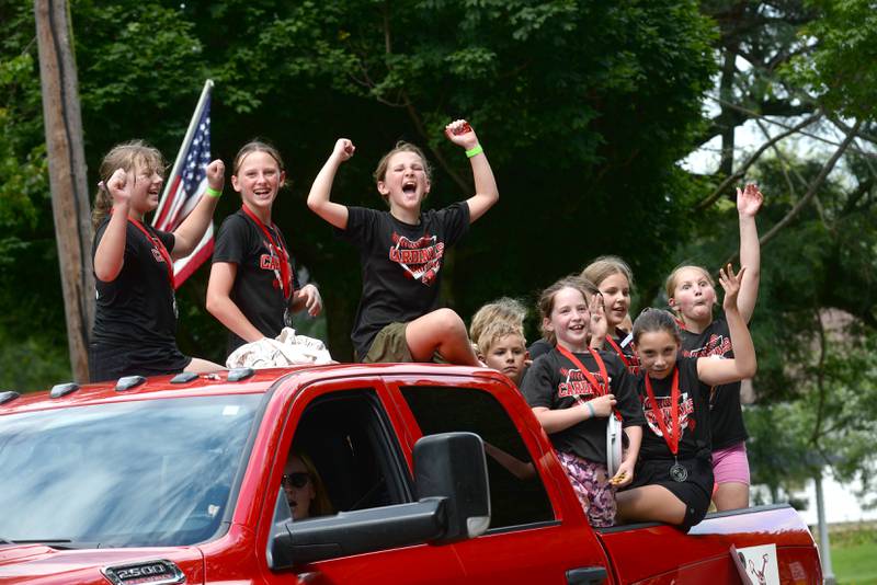 A German Valley youth softball team reacts to the crowd as they ride in the German Valley Days parade on Saturday, July 19, 2025.