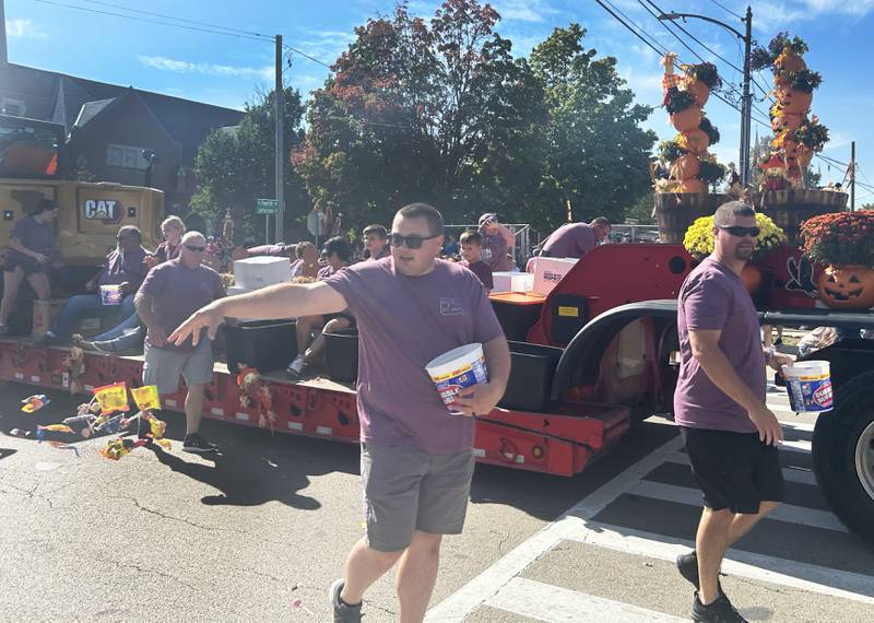 Employees of  Martin & Co. handed out candy during the Harvest Time Parade during the Autumn on Parade festival on Sunday, Oct. 5, 2025 in Oregon