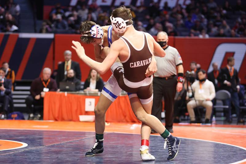 Marmion’s Jameson Garcia drops Mt. Carmel’s Damian Resendez in the Class 3A 113lb. championship match at State Farm Center in Champaign. Saturday, Feb. 19, 2022, in Champaign.