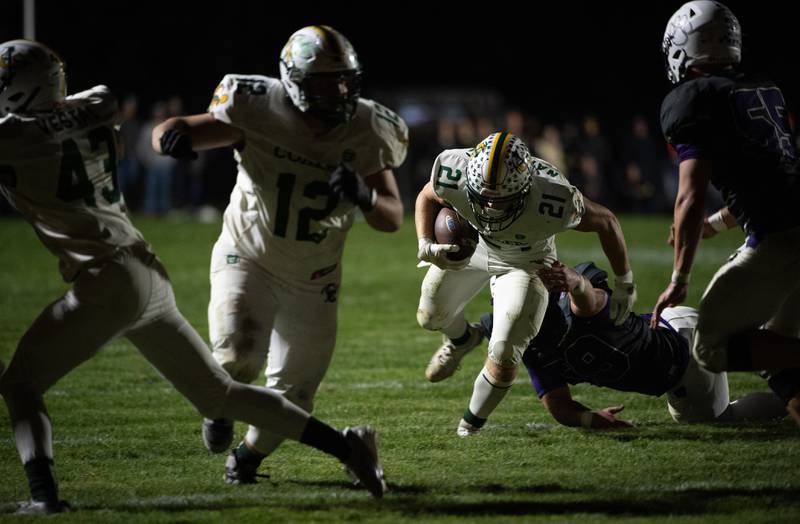 Coal City's Logan Natyshok carries the ball on a play in a game against Wilmington on Friday, October 24, 2025.