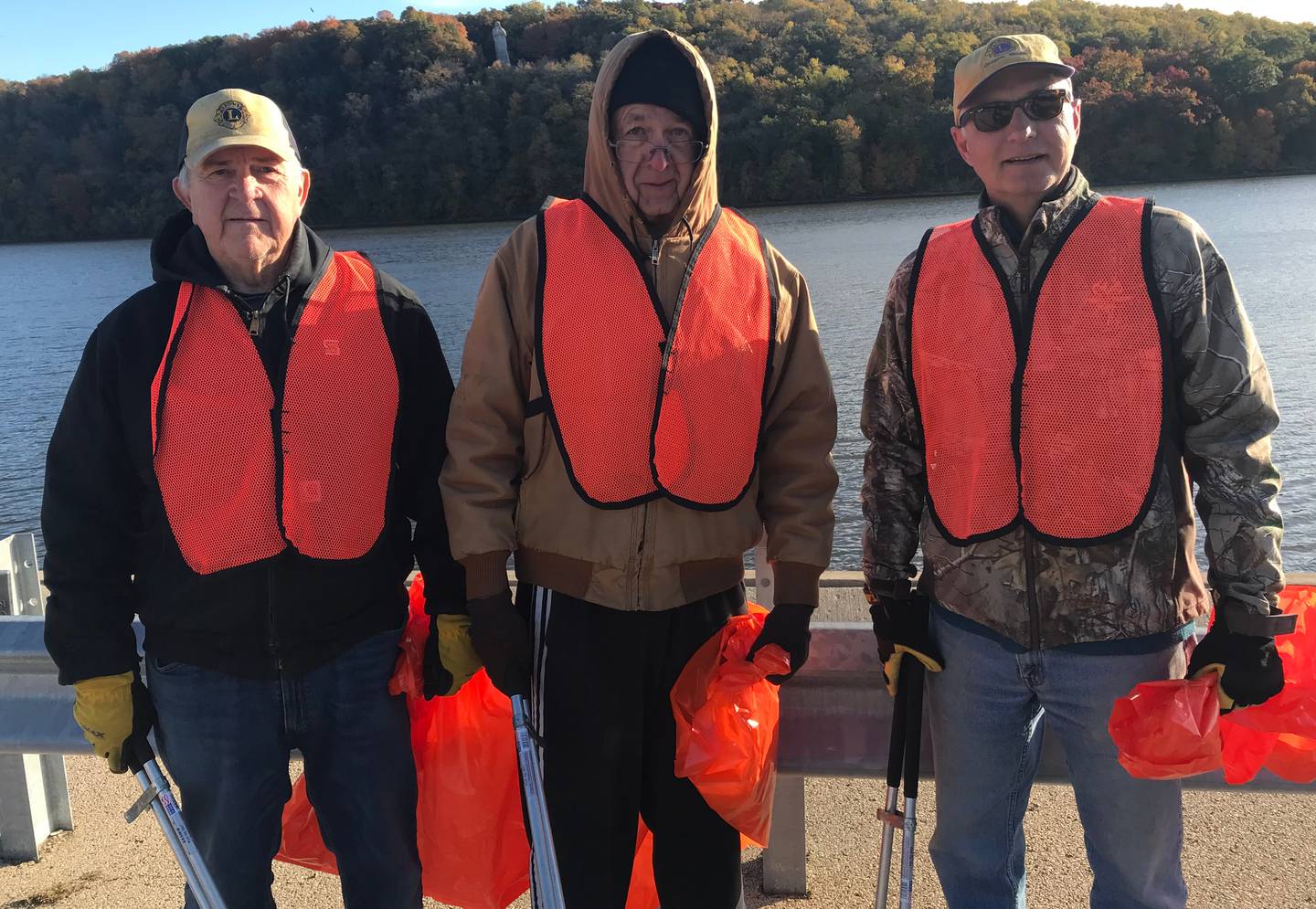 (Left to right): Oregon Lions Club members Doug Moser, Jerry Hinrichs, and Chairman Grant Afflerbaugh participating in the groups' last roadside cleanup of the year along Illinois Route 2 South Tuesday, Oct. 18. Not pictured is Lions member Jim Hoff.