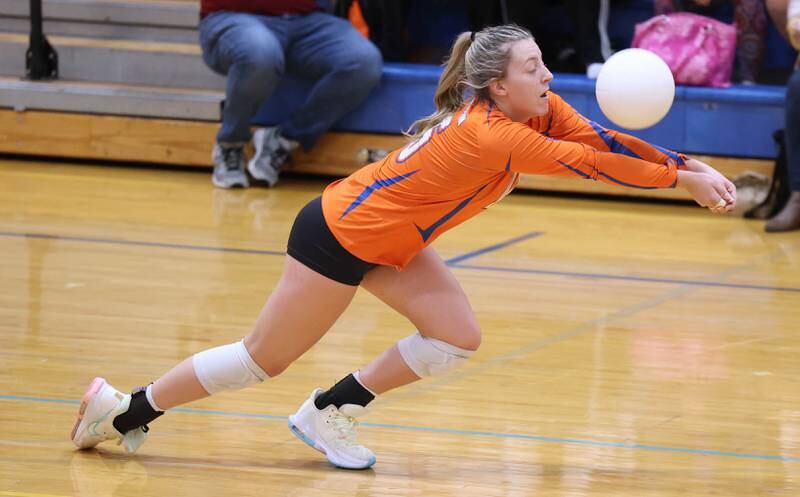 Genoa-Kingston's Alayna Pierce dives for the ball during their Regional semifinal match against Rosary Tuesday, Oct. 25, 2022, at Rosary High School in Aurora