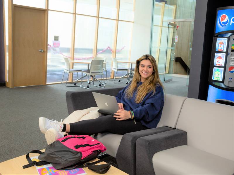 A student studies on her laptop in Illinois Valley Community College’s Student Center. Summer online and in-person classes begin May 16.