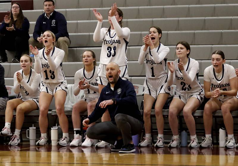 Cary-Grove Head Coach Tony Moretti and the bench cheer as Cary-Grove tries to come back int he third quarter of an IHSA Class 3A Antioch Sectional semifinal girls basketball game on Tuesday, Feb. 20, 2024, at Antioch High School.