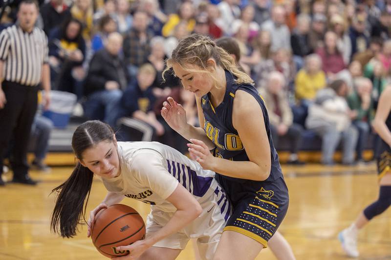 Polo’s Bekah Zeigler works against Orangeville’s Kaylynn O’Haver Tuesday, Feb. 21, 2023 in the sectional semifinal.