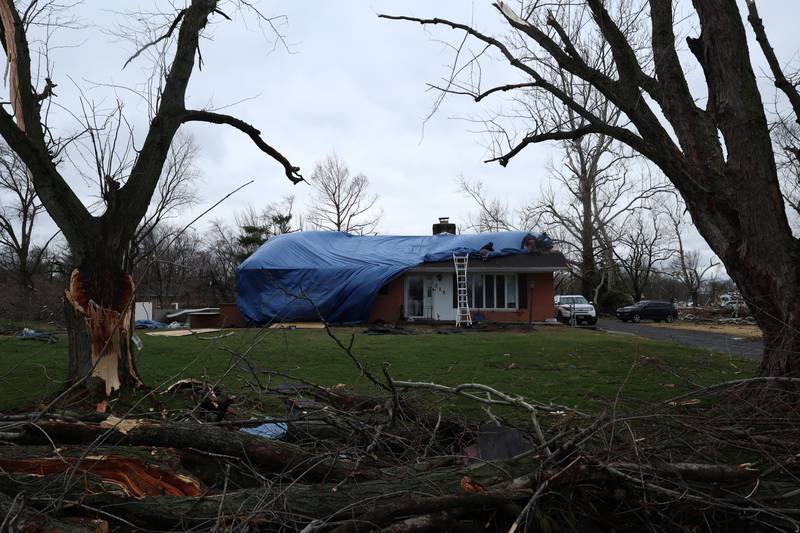 Damage to homes is seen along Julie Drive in Aroma Park on March 11, 2026 following a March 10 tornado that passed through Kankakee County.