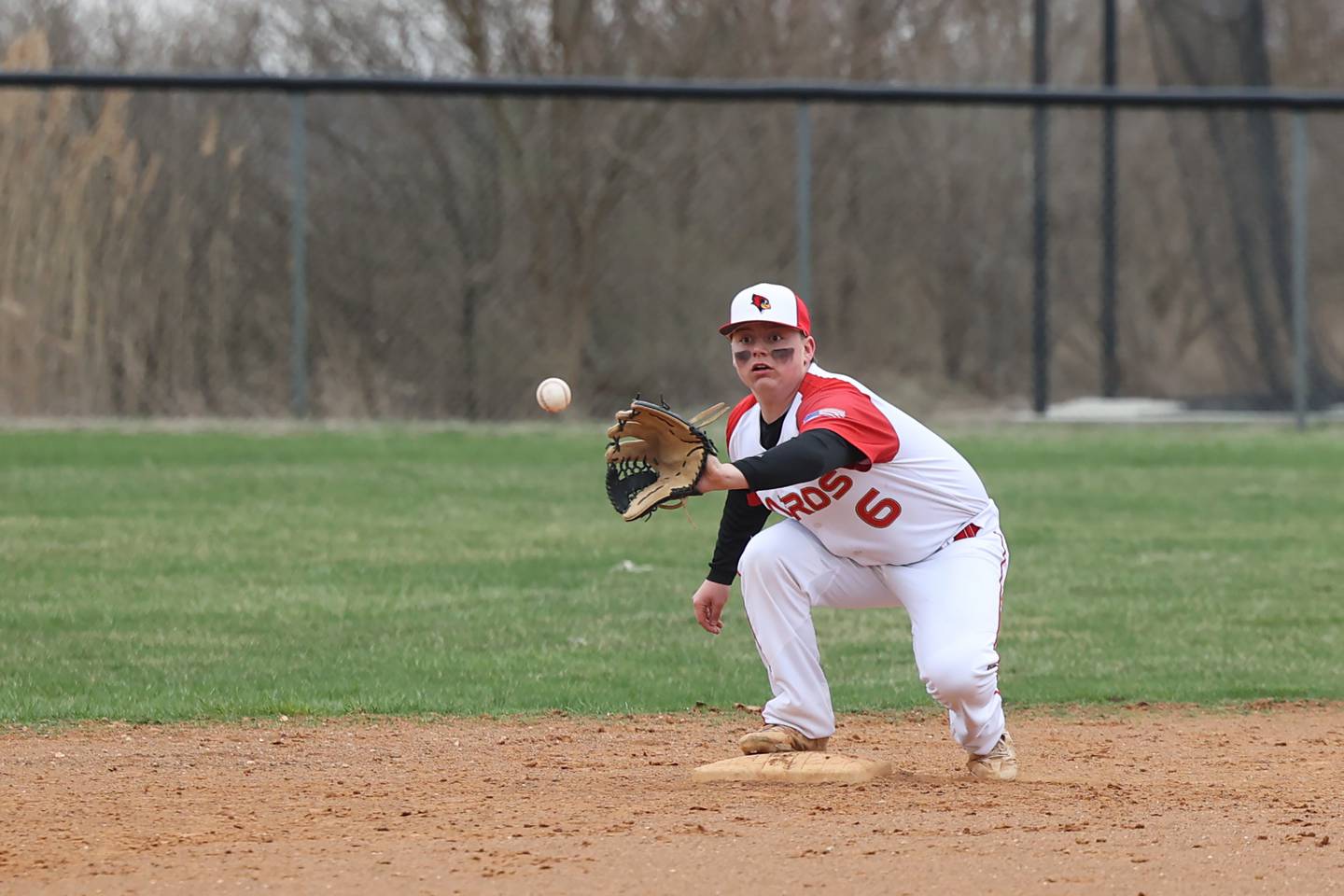 St. Anne-Donovan's Preston Harrington-DeWitt catches an out at second base during the Cardinals' 1-0 loss to Central on Tuesday, April 1.