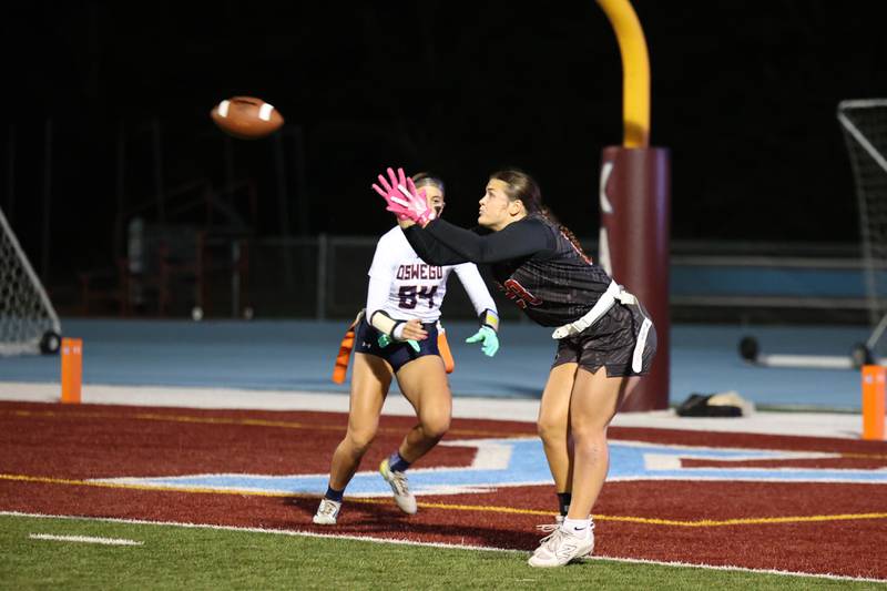 Yorkville's Kayla Kersting catches the game-winning touchdown as Oswego's Sophie Augustine closes in during the Foxes' 2-1 overtime victory over Oswego in the IHSA Kankakee Regional championship game on Thursday, Oct. 9, 2025.