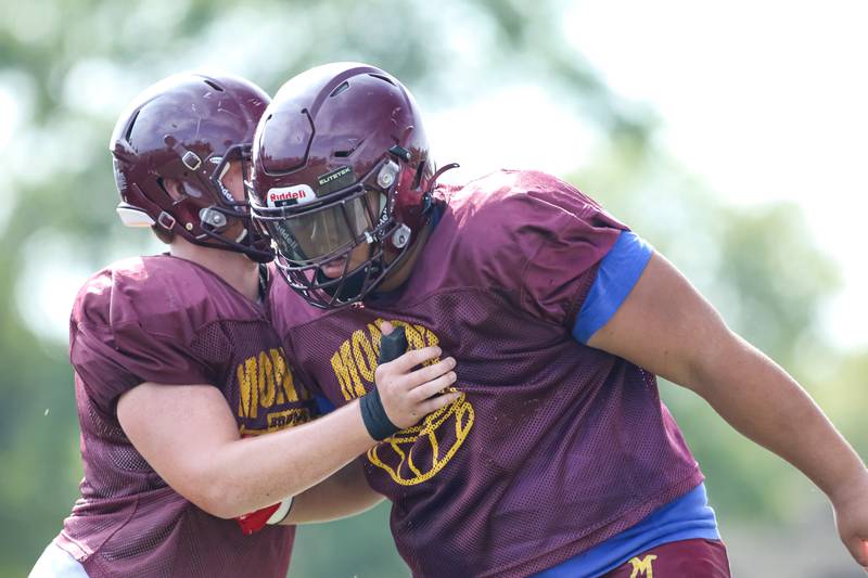 The defensive line goes through pass rushing drills during Montini High School football practice. Aug 22 2024.