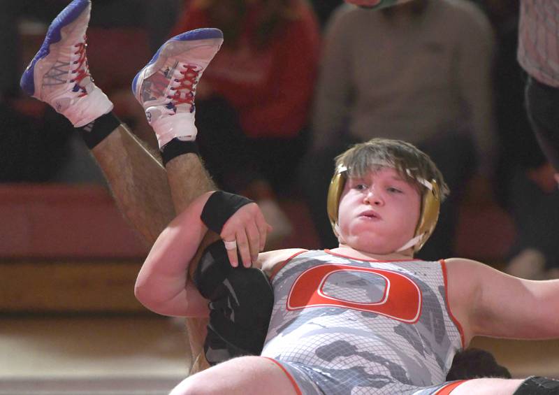 Oregon's jacksyn Windham tries to break a hold by Newman's Matthew Clemen during their 215-pound bout at the Oregon Quad meet on Saturday, Jan. 17, 2026 at the Blackhawk Center in Oregon.