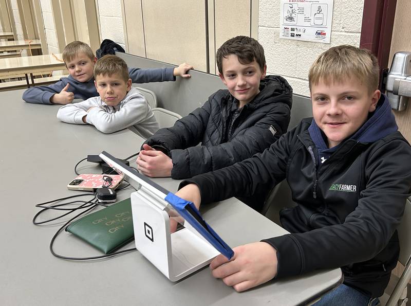 Hezkiah Krogman, Andrew Meyers and Brayden and Titus Krogman took care of the money during the meal at the Forreston Grade School during Christmas in the Country on Friday, Dec. 5, 2025.