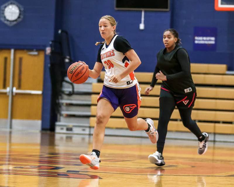 Oswego's Peyton Johnson dribbles down court at the Oswego girls basketball shootout tournament. June 28, 2024.