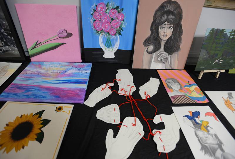 Nazareth art work is posted through campus during the Expressive Arts Showcase held Monday, April 8, 2024.