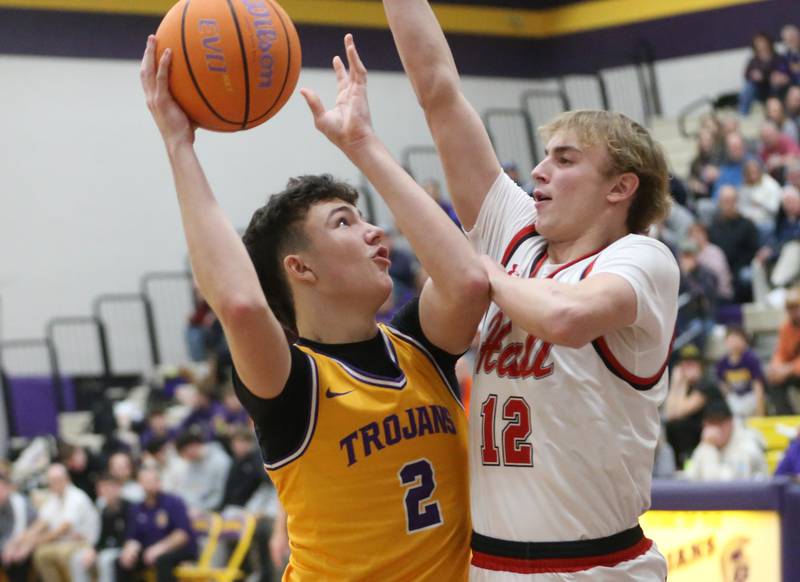 Mendota's Drew Becker gets in the lane as Hall's Hunter Edgcomb defends on Tuesday, Feb. 3, 2026 at Mendota High School.