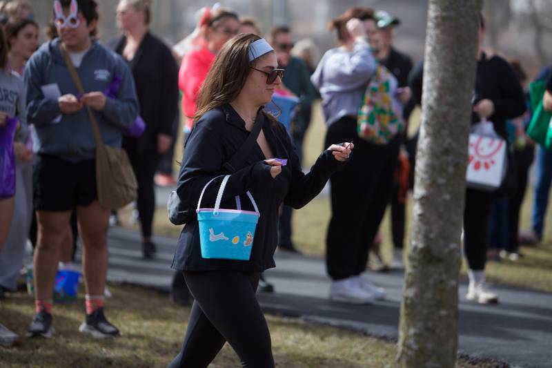 Raffle winner goes to claim her prize at the  Adult Easter Egg Hunt on Saturday, March 15, 2025 at Berens Park in Elmhurst.