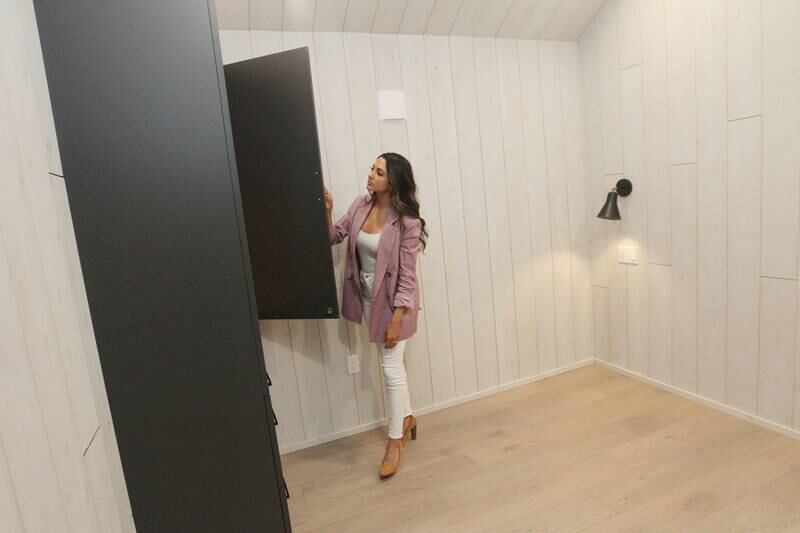 Anisha Seltenright, member, chief marketing officer, opens up a closet in a bedroom that can fit a queen or a king bed comfortably in a Milla Long, the largest unit of a prefabricated tiny home, under construction for a customer in Stowe, Vermont in the production facility at PrefabPads LLC in Waukegan on July 17th, 2023.
Image by Candace H. Johnson for Shaw Local News Network