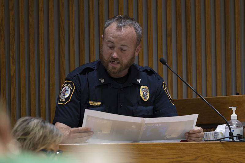 Rock Falls police officer Ryan McKanna reviews stills taken from his body cam while working the fatal fire. McKanna testified Tuesday, July 16, 2024, during the trial of Steven W. Coleman, who is accused of setting the fire that killed three.