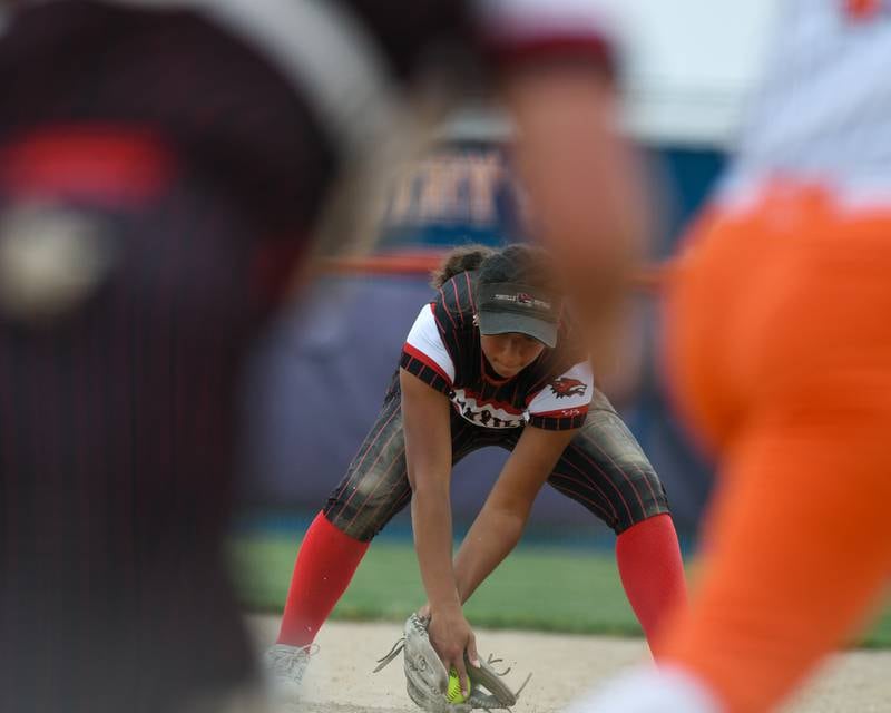 Yorkville's Liv Lathen (5) fields the ball and throws an Oswego runner out during the sectional semifinals game on Tuesday June 3, 2025, held at Oswego High School.