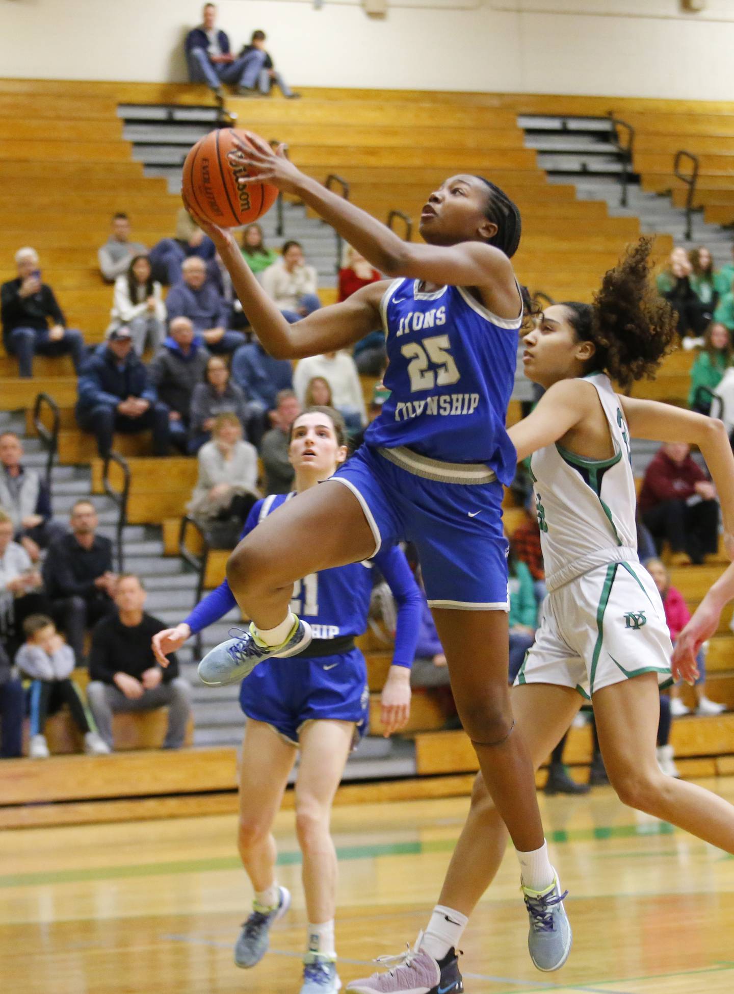 Lyons' Nora Ezike (25) drives to the basket during the girls varsity basketball game between Lyons Township and York high schools on Friday, Dec. 16, 2022 in Elmhurst, IL.