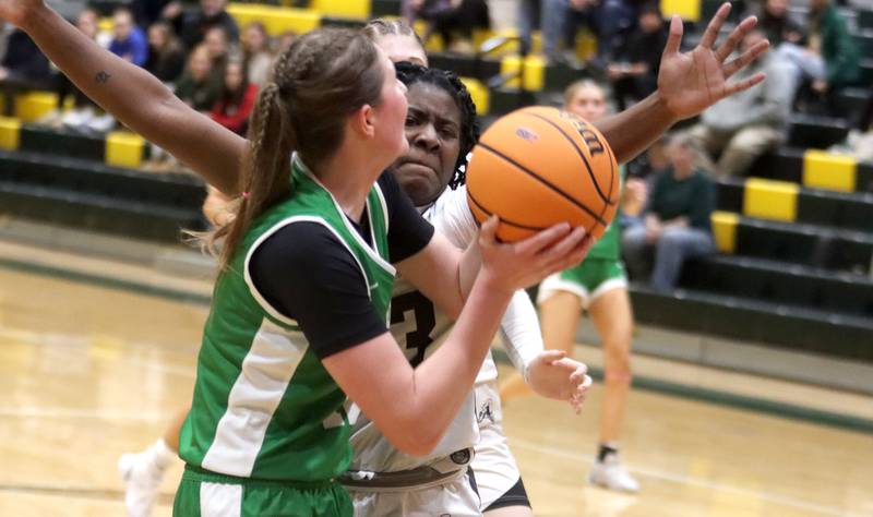 Kaneland’s Amani Meeks, back, focuses on Crystal Lake South’s Gaby Dzik in IHSA Class 3A Regional Title Game girls basketball action on Friday, Feb. 21, 2025, at Crystal Lake South High School in Crystal Lake.