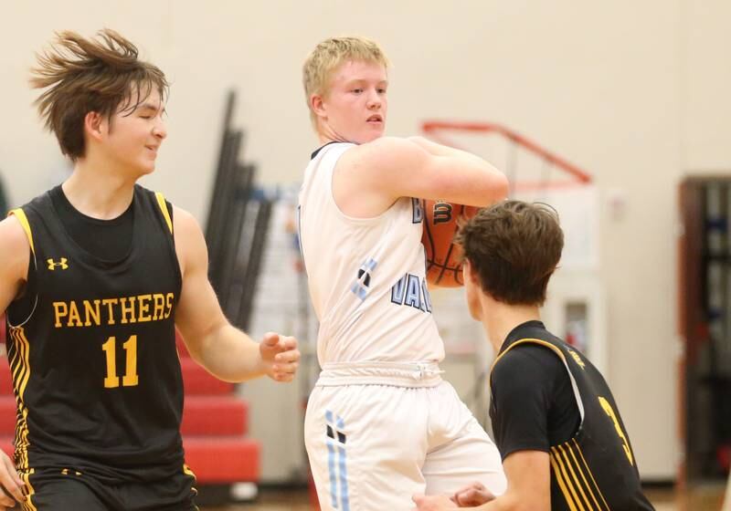 Bureau Valley's Bryce Helms tucks the ball away from Putnam County's Owen Saepharn and teammte Bryce Smith during the 49th annual Colmone Class on Thursday, Dec. 7, 2023 at Hall High School.