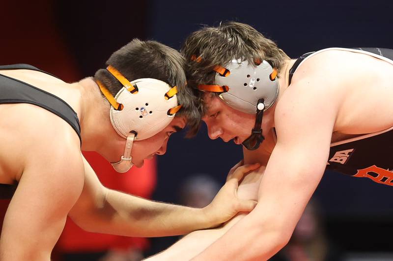 Dekalb’s Bradley Gillum (right) faces off with Libertyville’s Josh Knudten in the Class 3A 182lb. championship match at State Farm Center in Champaign. Saturday, Feb. 19, 2022, in Champaign.