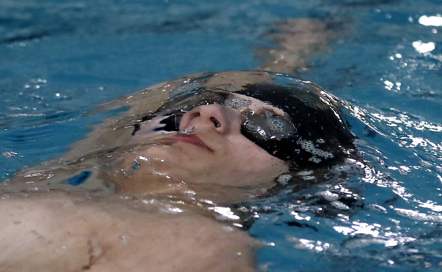 Woodstock North’s Niko Myshkowec competes in the 200 backstroke during the Fox Valley Conference Invitational swim meet on Saturday,  Feb. 15, 2025, at Woodstock North High School.