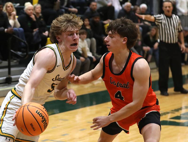 Crystal Lake South's Carson Trivellini drives the baseline against Crystal Lake Central's Bud Shanahan during an IHSA Class 3A Crystal Lake South Regional boys basketball semifinal game on Wednesday, February, 25, 2026, at Crystal Lake South High School.
