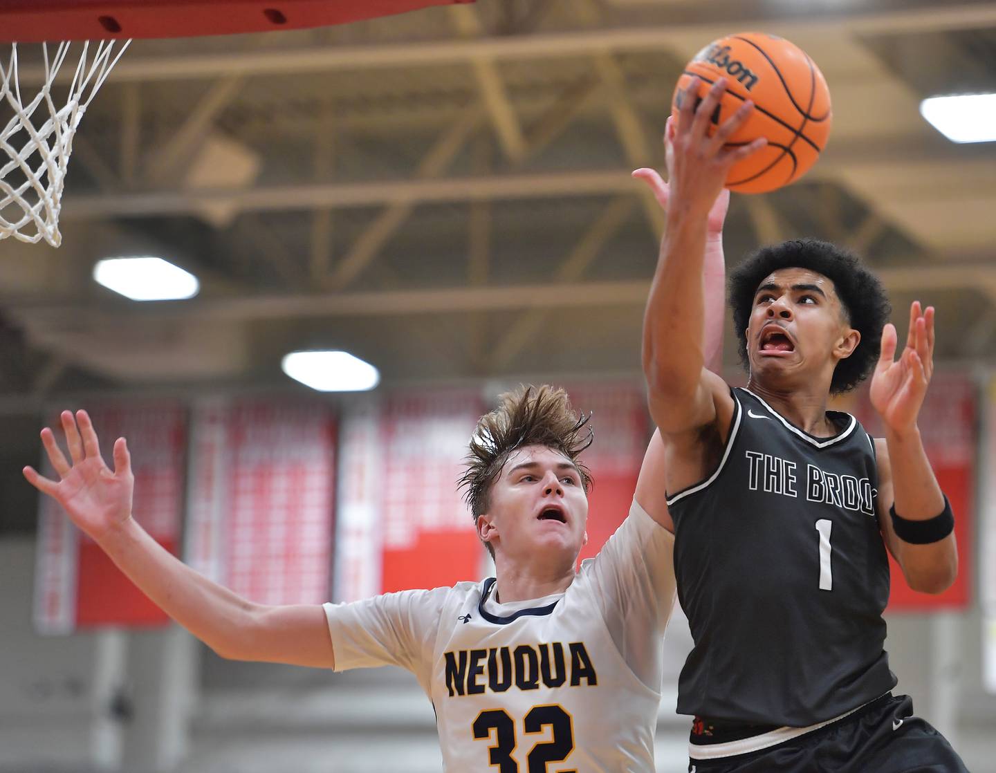 Bolingbrook’s Brady Pettigrew (1) goes to the basket as Neuqua Valley’s Cole Kelly defends during a When Sides Collide Shootout game on January 24, 2026 at Benet Academy in Lisle.
