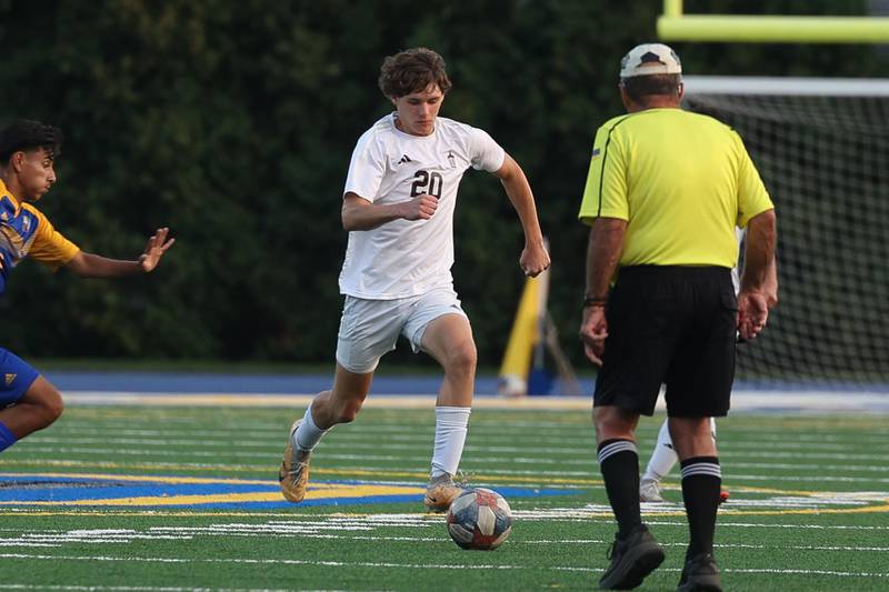 Joliet Catholic’s Liam Connolly works the ball upfield against Joliet Central on Monday, Sept. 9, 2024 in Joliet.