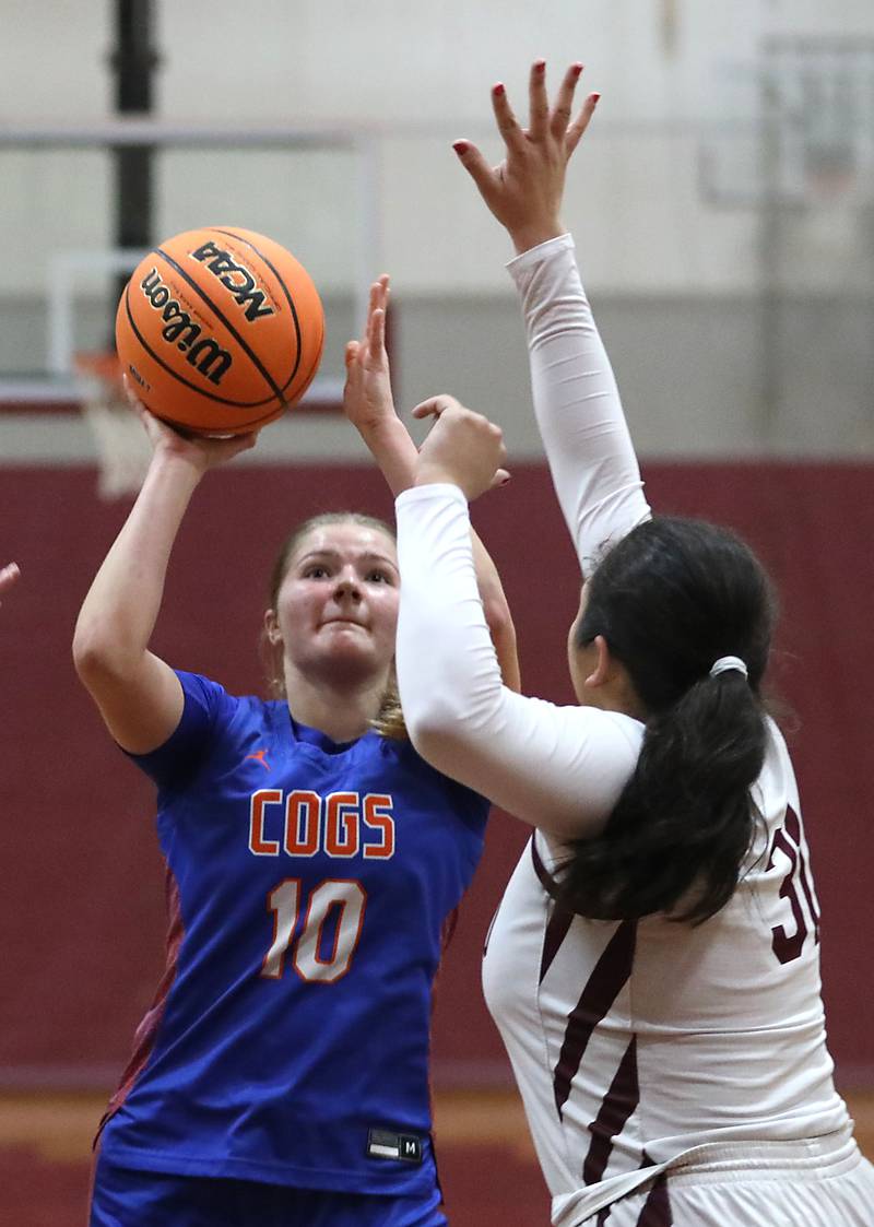 Genoa-Kingston's Arielle Rich shoots the ball over Marengo's Ariana Rodriguez during an IHSA Class 2A Marengo Regional semifinal girls basketball game on Monday, Feb. 16, 2026, at Marengo High School.