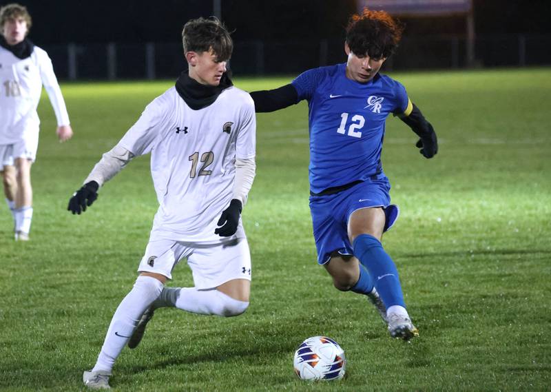 Sycamore's Andre Crouch (left) and Burlington Central’s David Mancera race after a loose ball Tuesday, Oct. 21, 2025, during their IHSA Class 2A regional semifinal match at Burlington Central High School.