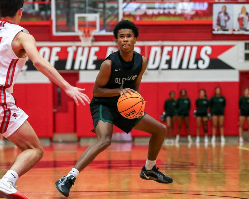 Glenbard West's TJ Williams (3) steps back to get open for a jumper during their basketball game between Glenbard West at Hinsdale Central, Friday  Dec 6, 2024  in Hinsdale.