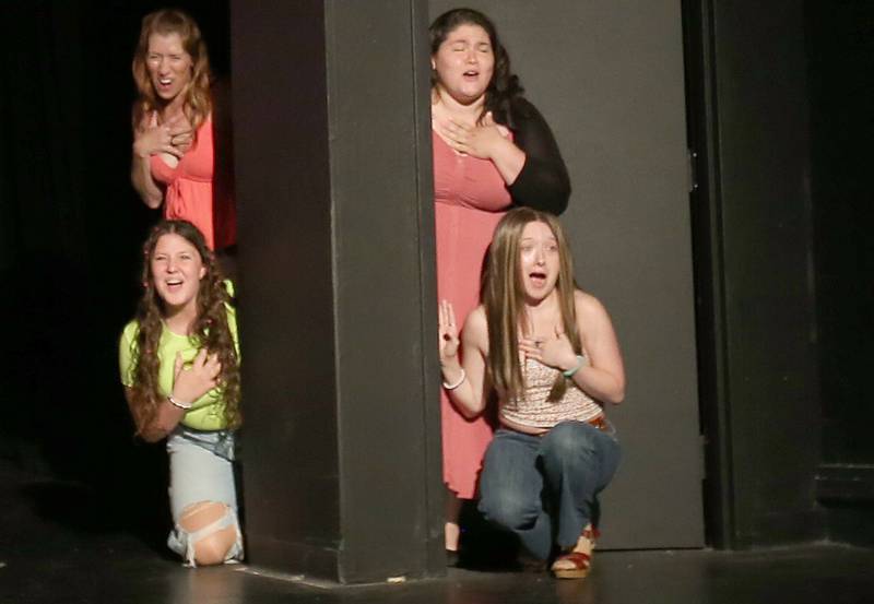 (From left) Jamie Parks, Lainey Johns, Enid Hoopes and Emma Woulfe act out a scene during a rehearsal of Legally Blonde on Tuesday, July 1, 2025 at Stage 212 in La Salle.