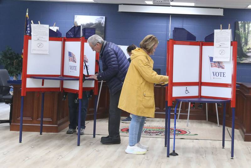Voters fill booths on Tuesday, April 1, 2025 at the Utica Village Hall. Utica has the Waltham School referendum on the ballot which states whether or not taxes should go up to pay for a permanent addition to the relatively new Waltham Elementary School, or if tax money should go toward keeping the temporary, modular classrooms operating.