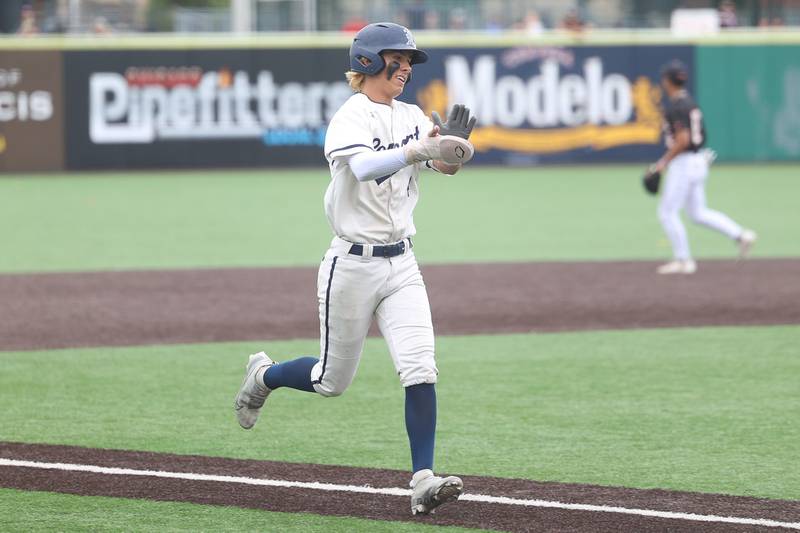 Lemont’s Brett Tucker celebrates as he heads home to score against Crystal Lake Central in the IHSA Class 3A Championship game on Saturday June 8, 2024 Duly Health and Care Field in Joliet.