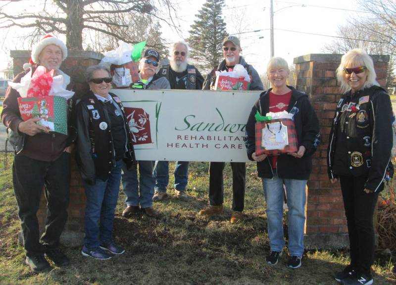 Pictured are ALR members Bill and Sally Kolb, Cliff Oleson, Bob Lawrence, Bob Mauer, Sandy Lawrence, and Cherie Mauer with their Christmas gifts for the veterans at Sandwich Rehabilitation and Health Center.