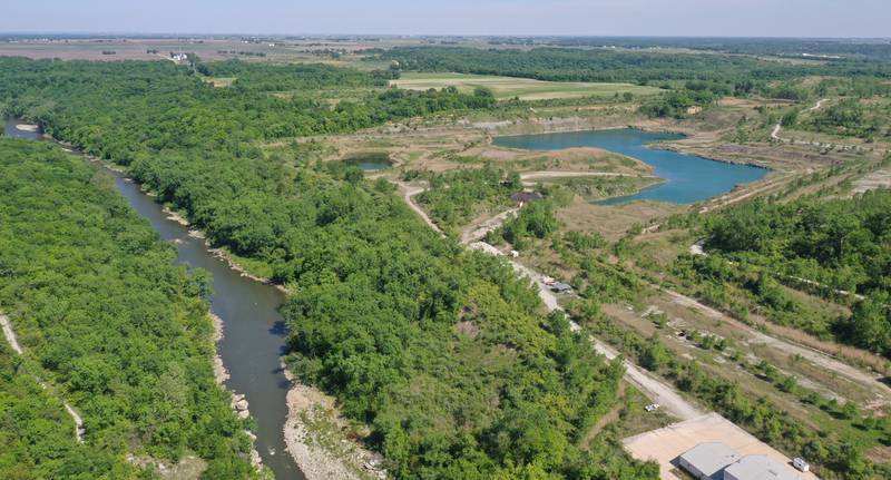 An aerial of the Vermilion River near the Buzzi Unicem plant on Friday, May 26, 2023 in Oglesby. The land seen here is part of the 2,629 acres of land added to Starved Rock and Matthiessen state parks in 2018.