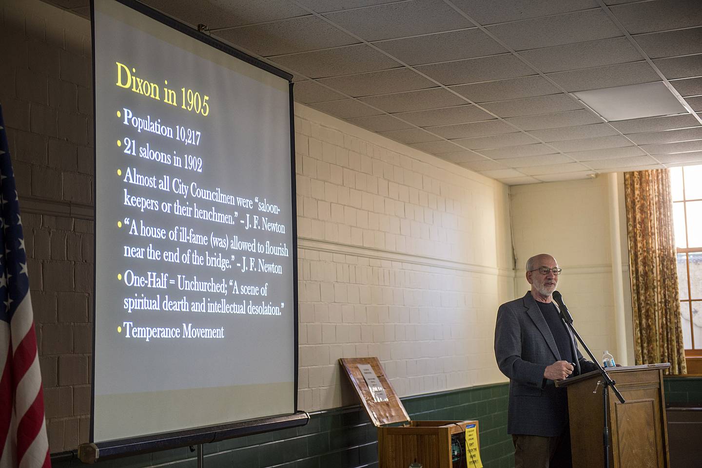 Tom Wadsworth gives a brief description of Dixon as it was in 1905 during a commemoration of Founders Day held Monday at Loveland Community Building. About 150 people attended the presentation, mainly focused on the winter revival held by Billy Sunday that year.  At the time of the revival Dixon was described as “ scene of spiritual dearth and intellectual desolation.” Saloons were prevalent and nearly all city council members were “saloon-keepers or their henchmen.”