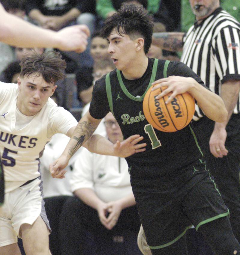 Rock Falls player Austin Castenada drives the ball aroundDixon's Brady Feit. Dixon hosted Rock Falls in boys basketball Friday, February 14, 2025 at Lancaster Gym at Dixon High School. Rock Falls won a hard fought game 48-46.