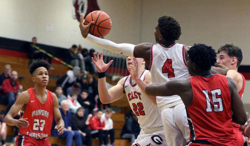 Glenbard East's LaDonus Rogers grabs a rebound against Aurora Christian during the When Sides Collide Shootout at Glenbard East on Jan 25 2020. Rogers scored 19 points Saturday in a loss to Naperville Central, a day after scoring a career-high 27.
