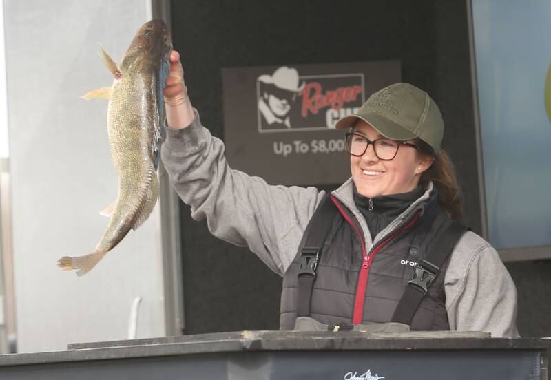 Jena Herrick of Spring Valley, holds up her big walleye fish that she caught during the annual Masters Walleye Circuit tournament on Friday, March 21, 2025 at the Spring Valley Boat Club.
